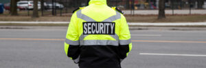 A closeup of a security guard watching the parking area